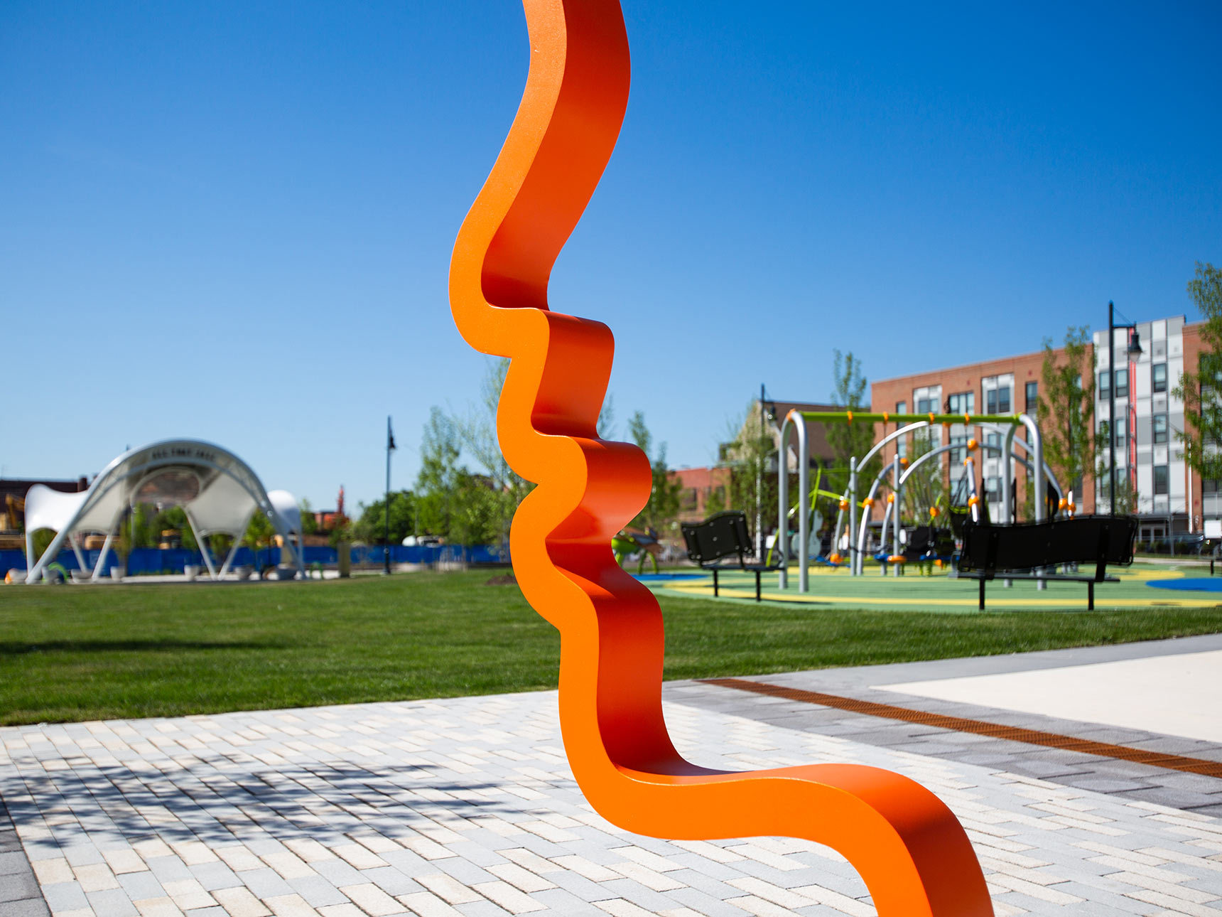 a detail photo of an orange sculptural profile, graphic outline of a face