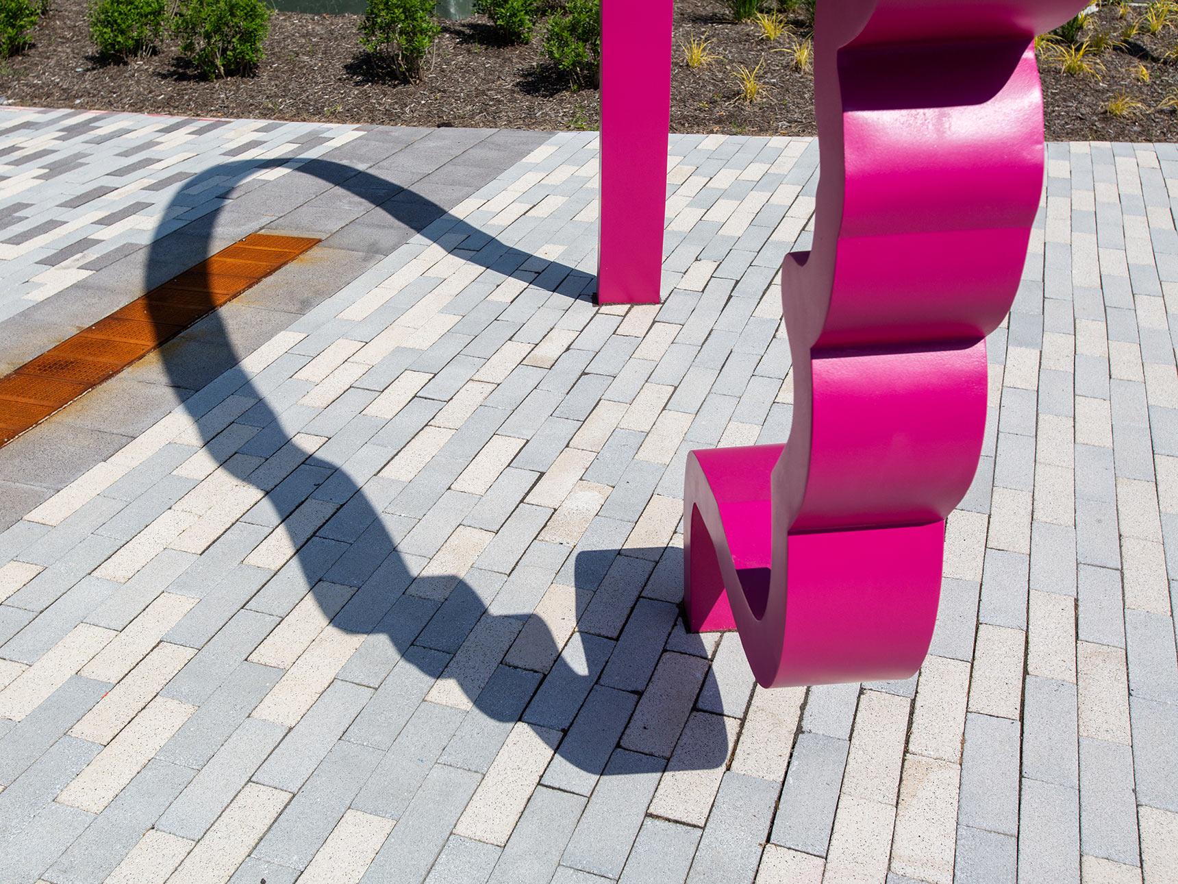 a detail photo of an magenta sculptural profile, graphic outline of a giant face