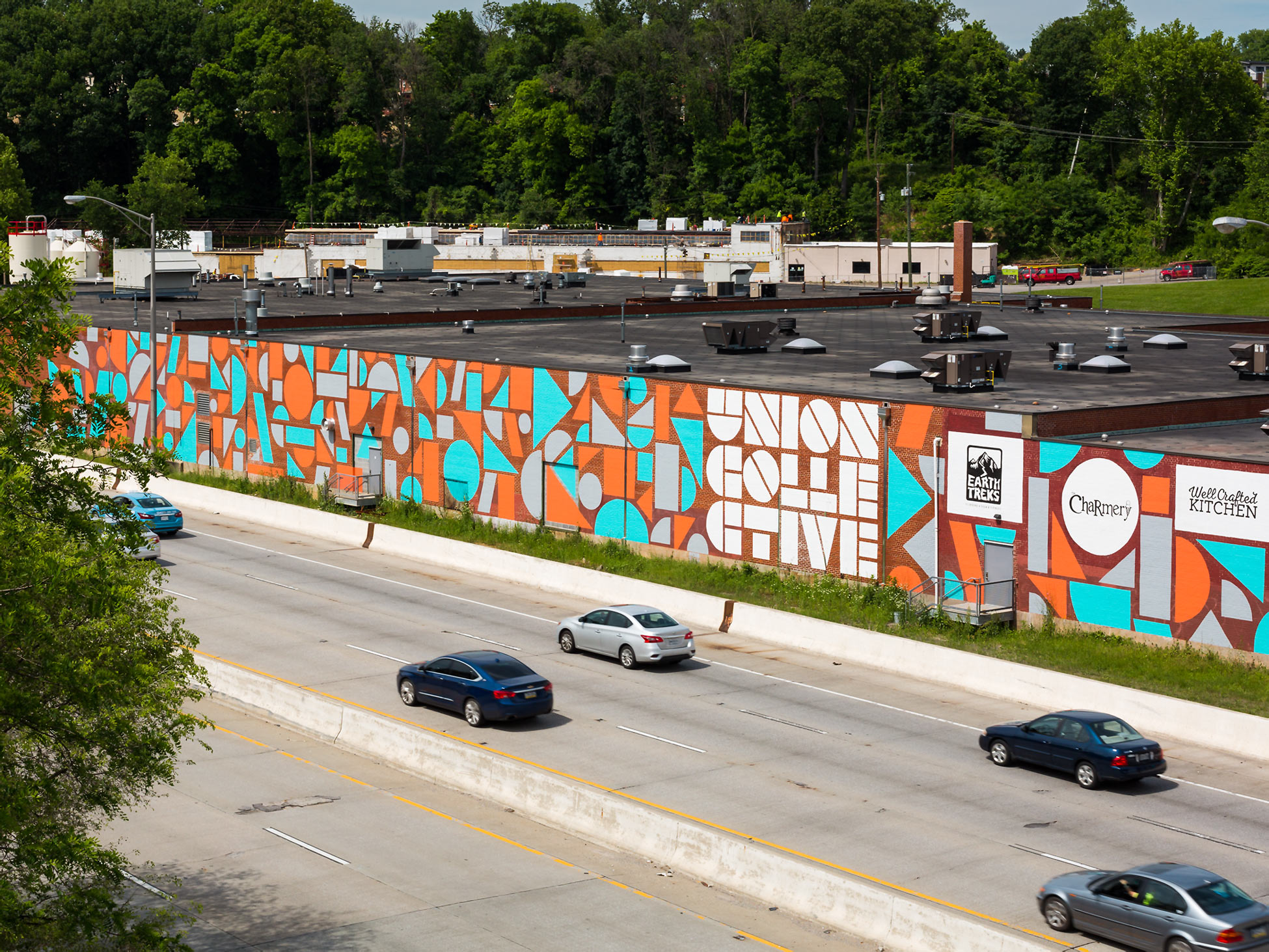 massive abstract painted mural art on the side of the Union Collective warehouse in Baltimore