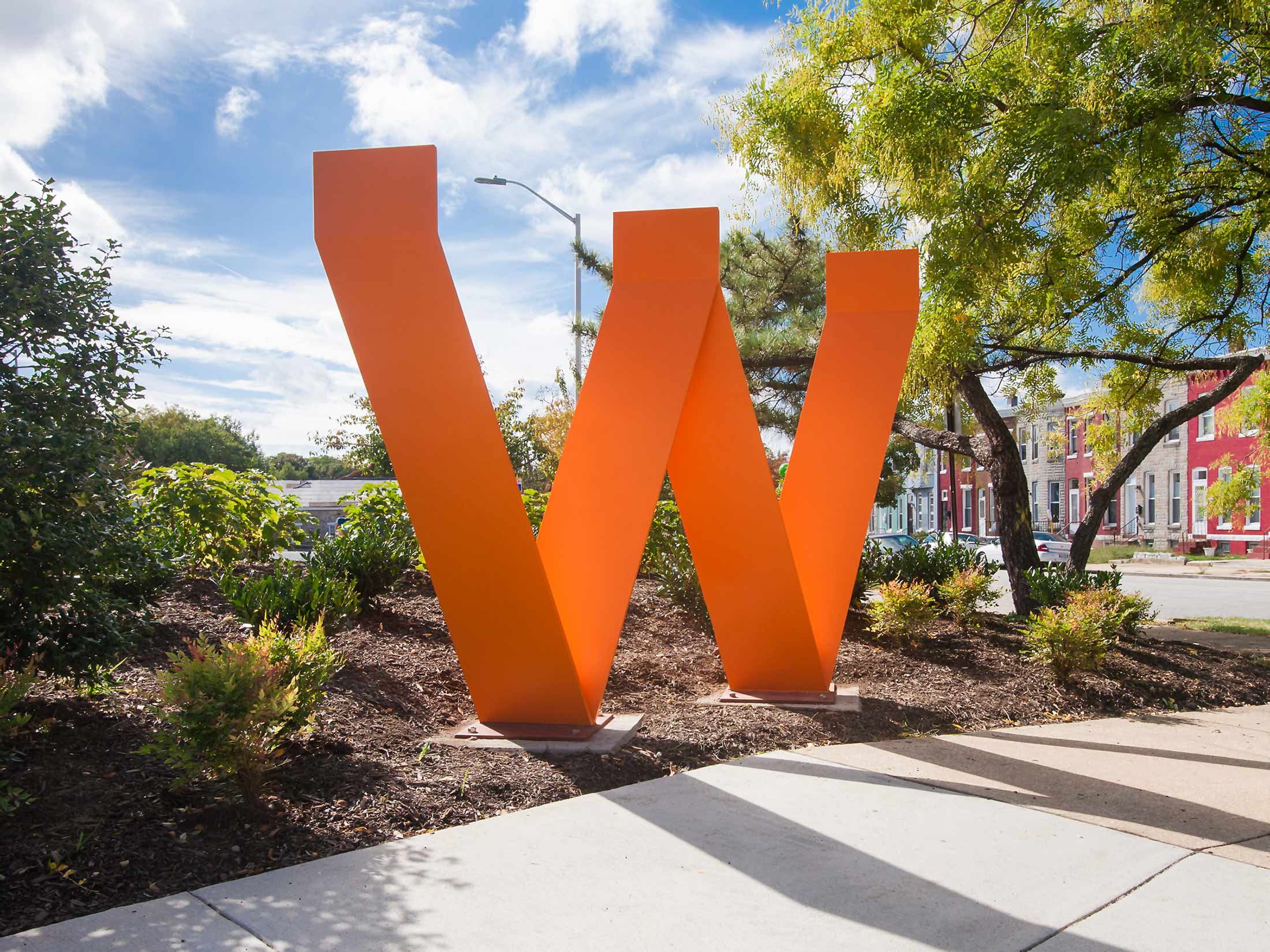 Waverly W large sculptural alphabet letter neighborhood gateway signage in Baltimore's Waverly neighborhood