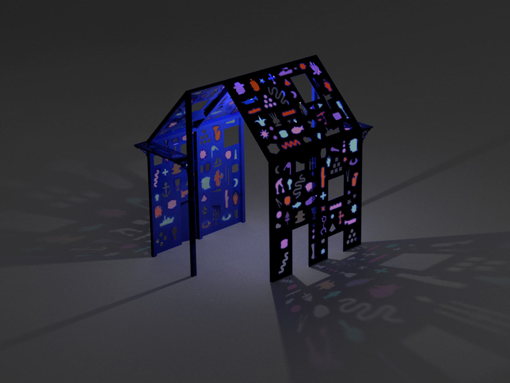 Hieroglyphic House, night rendering of a proposed public art installation of a deep blue house-like structure with walls and roofs punctured by windows of shaped iconographic imagery in vibrant colors. Sunlight streaming through these openings casts colorful shadows on the ground.