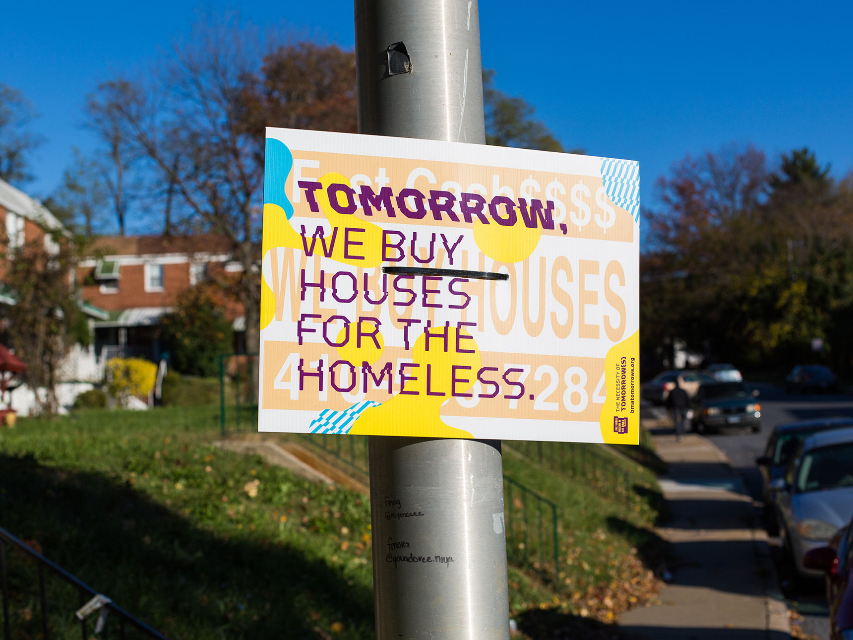 Tomorrow, we buy houses for the homeless. A detournement interrupted bandit sign public art piece