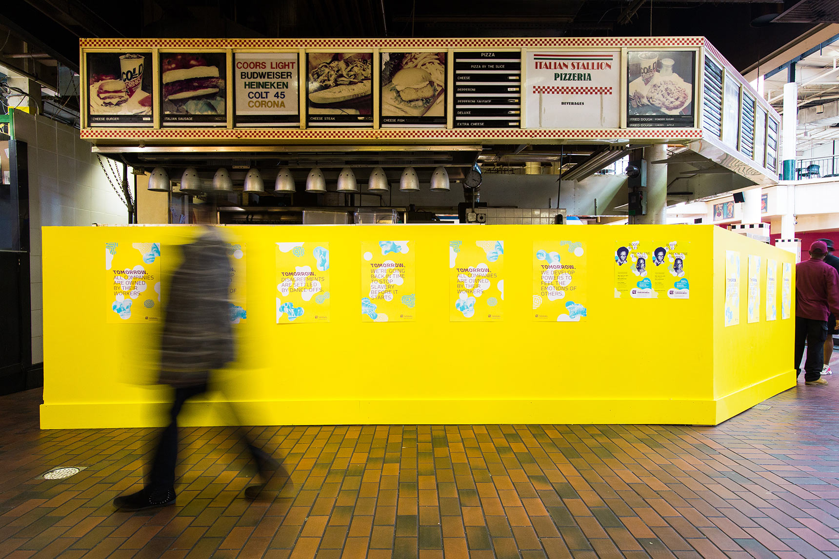 A poster installation at Lexington Market for Baltimore Museum of Art's Necessity of Tomorrow Lecture series