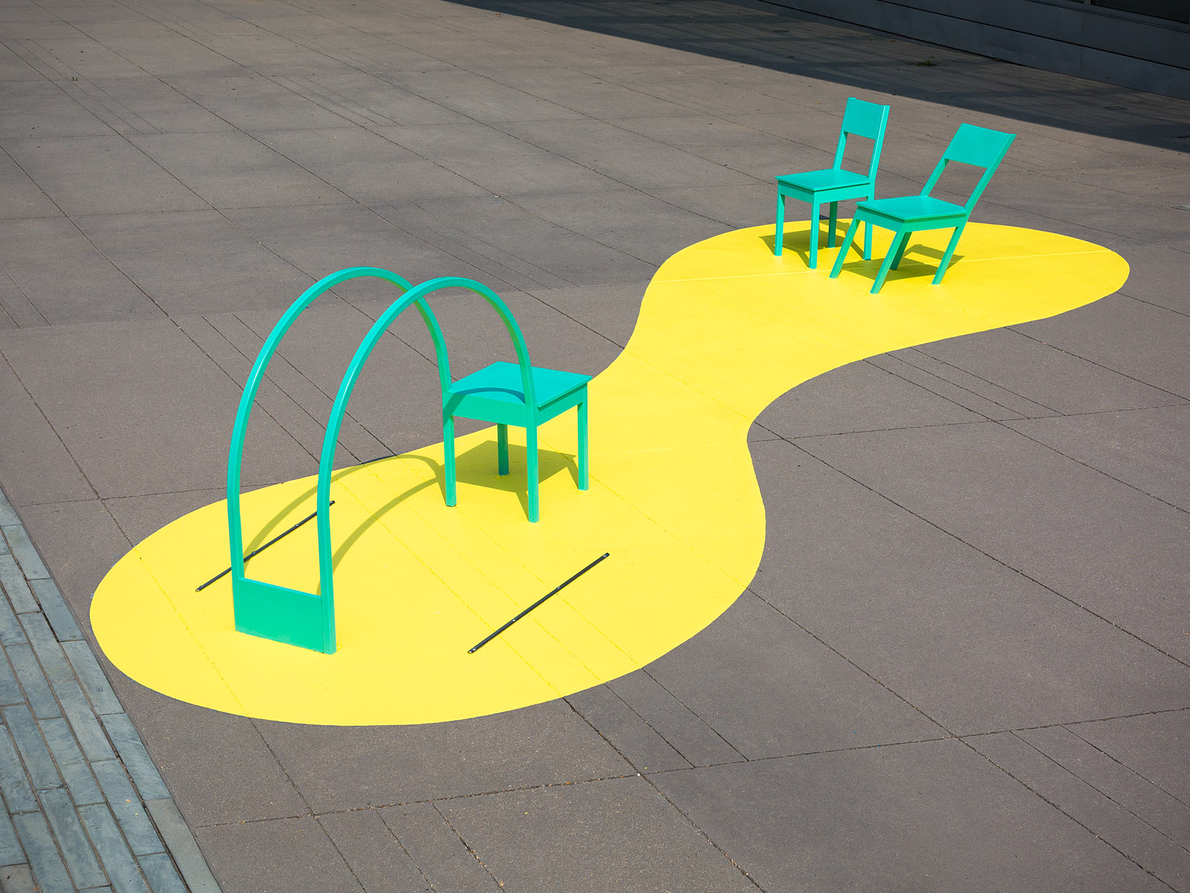 Yoga Chair and Skewed Chairs, optical illusion public art chairs