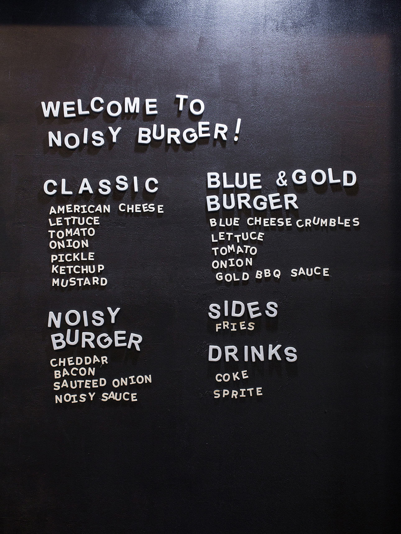 Noisy Burger fast casual restaurant menu board with moveable letters