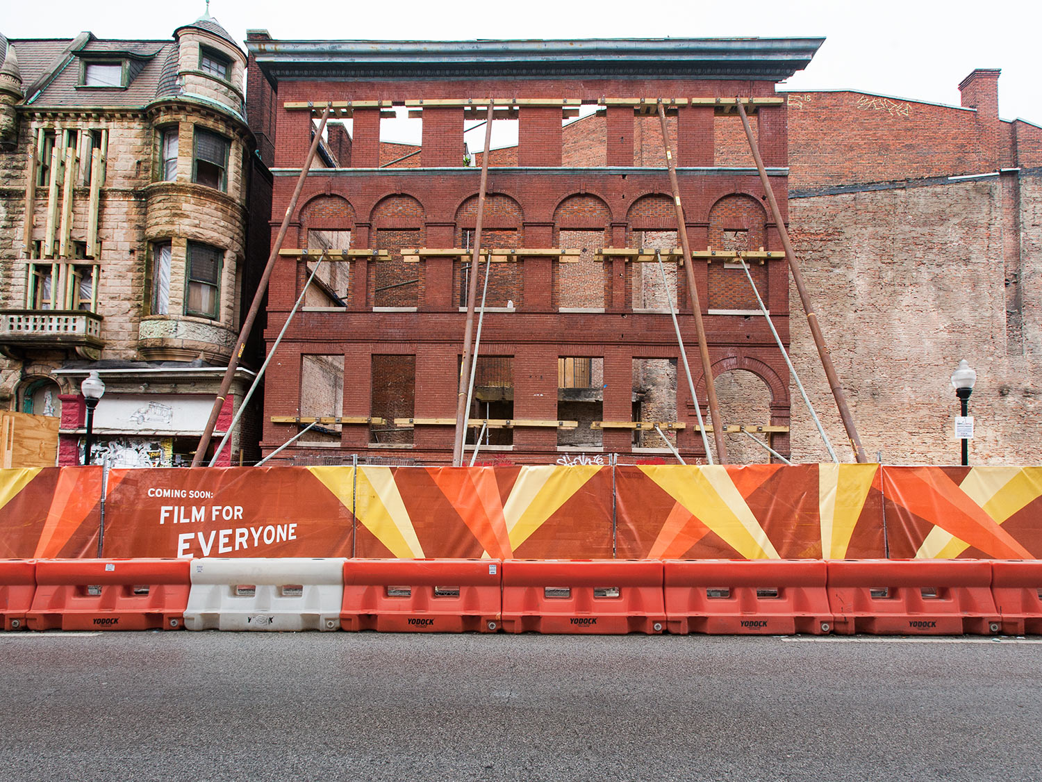 Construction fencing surrounding the Parkway Theatre in Baltimore during its renovation by the Maryland Film Festival