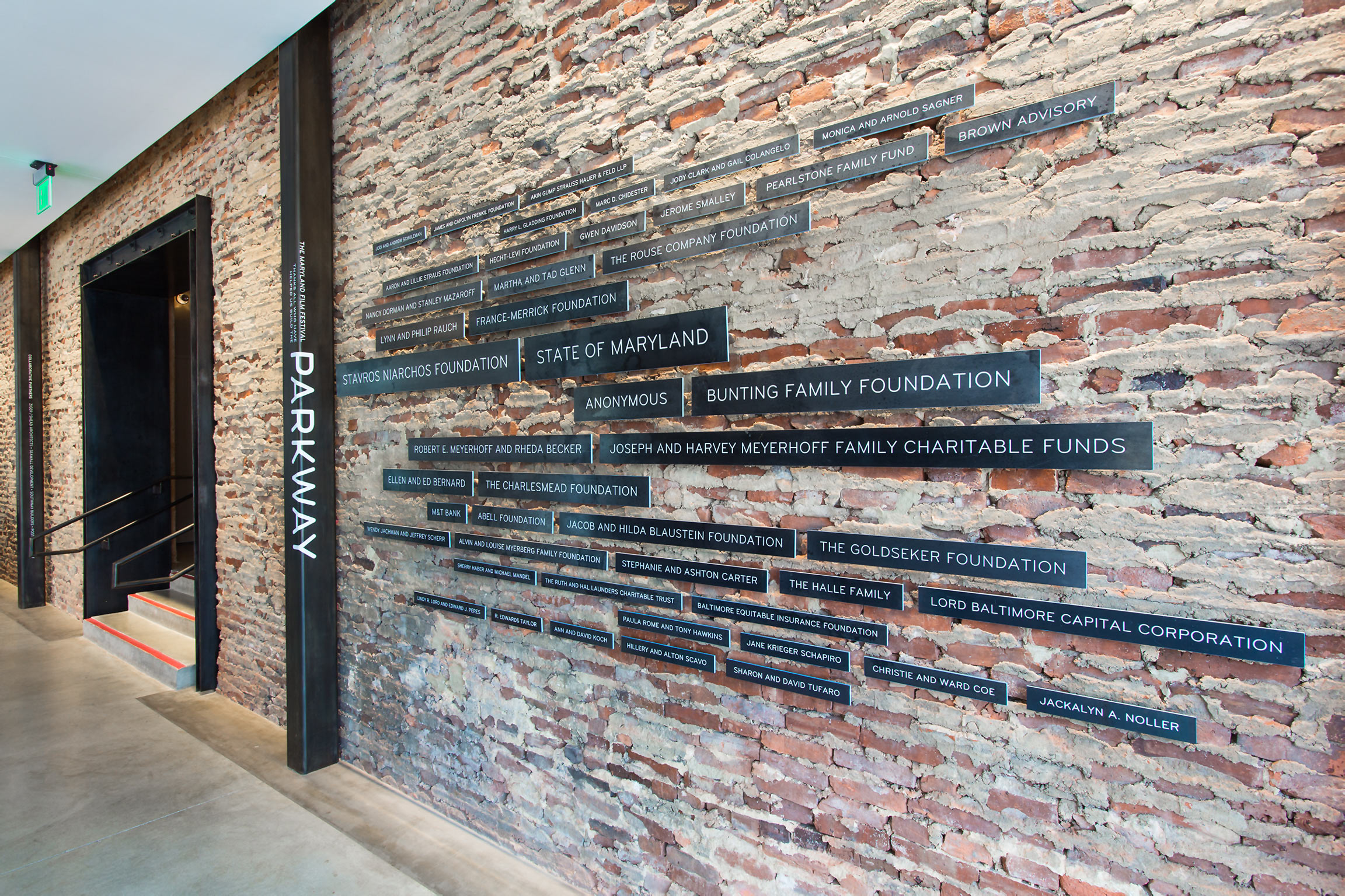 Contemporary sculptural steel donor wall design at the MdFF SNF Parkway Theatre, a film center in Baltimore