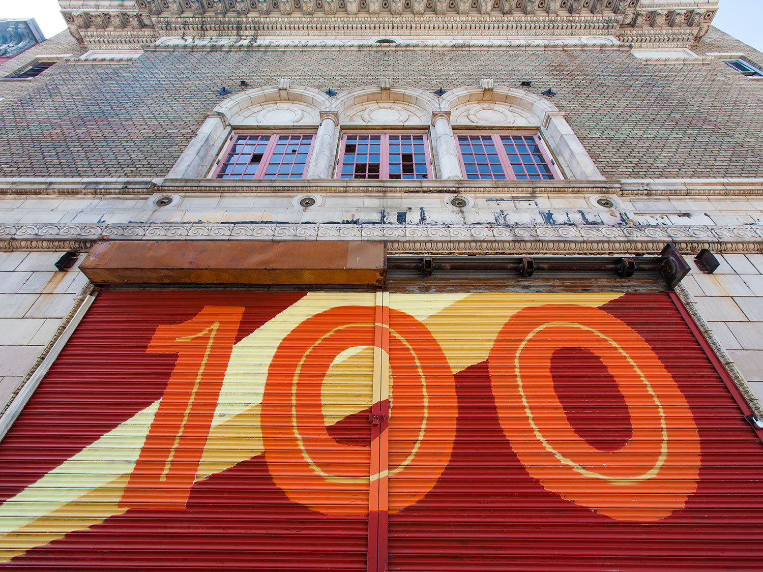 Giant 100 hand-painted mural on the Parkway Theatre in Baltimore to celebrate the building's centennial before renovation by the Maryland Film Festival