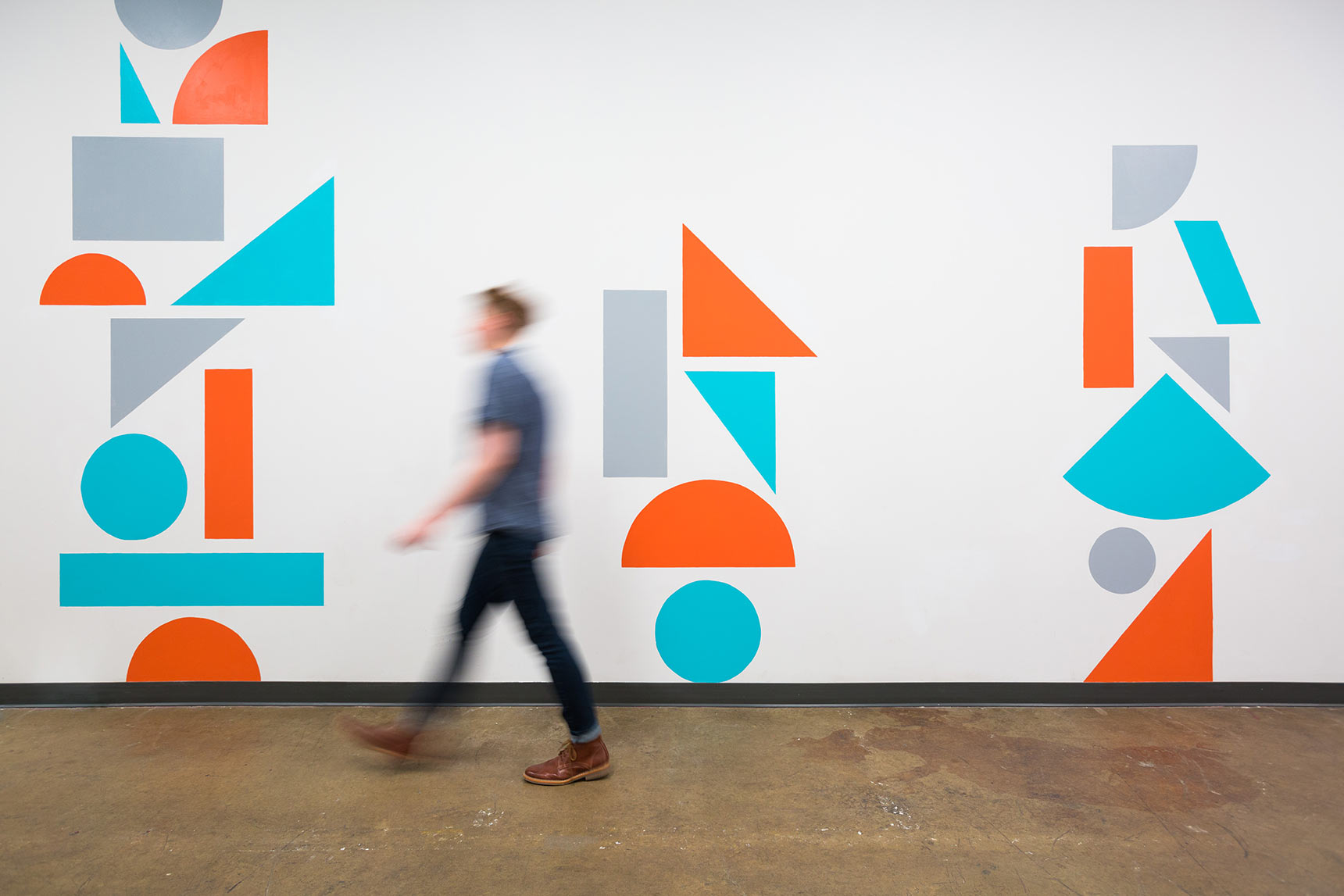 Colorful geometric shape supergraphic murals in the hallways of the Union Collective building