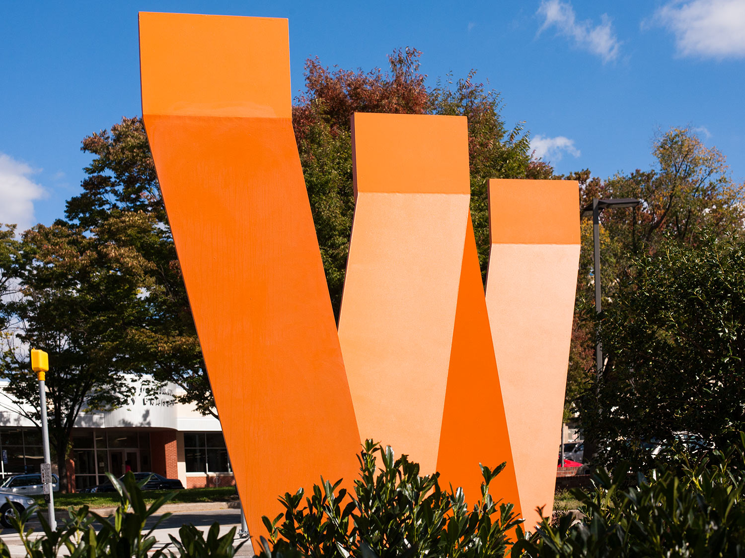 Waverly W large sculptural orange alphabet letter W, neighborhood gateway signage in Baltimore's Waverly neighborhood